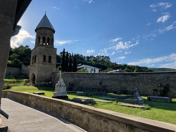 Samtavro monastery garden with cemetery and old bell tower