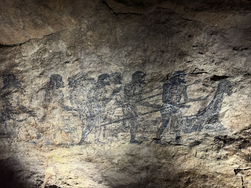 Prehistoric cave rock art with human figures