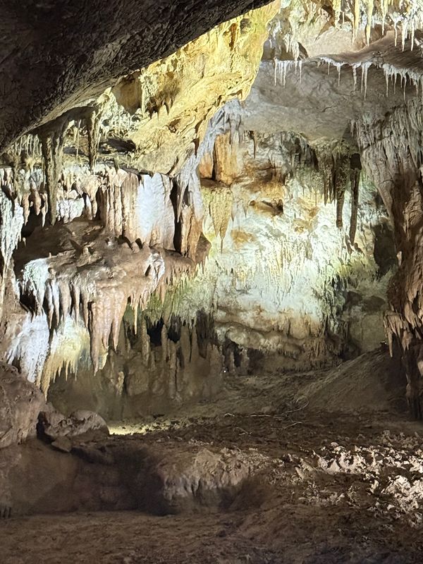 Drapery cave formations along the walls of Prometheus Cave