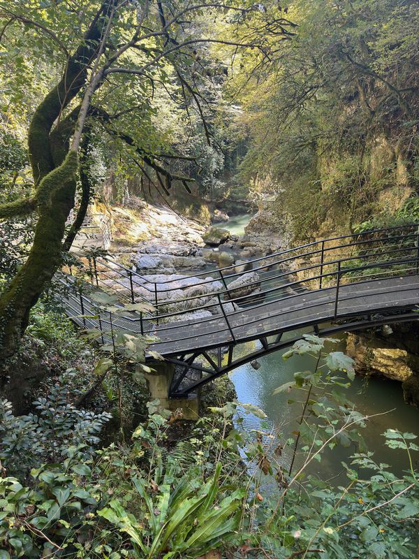 Bridge spanning between the rocky walls of the canyon